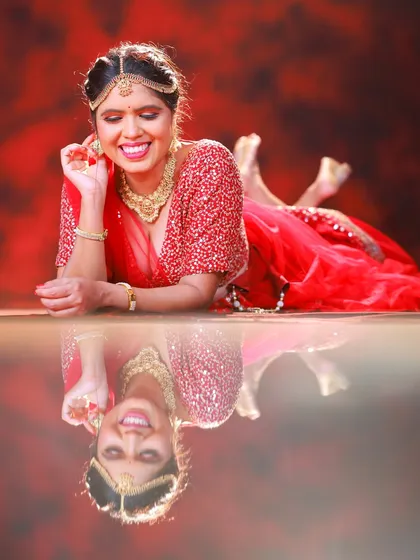 Another shot of the reclining pose with the reflection. The model's joyful, laughing expression makes this a wonderful, candid-feeling moment.