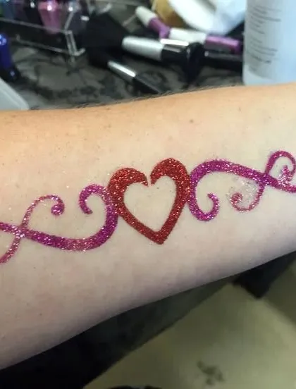 A classic heart and scroll design in red and purple glitter. This is a beautiful and popular choice for kids and adults alike.