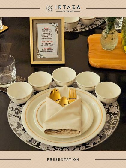 A detailed place setting showing a framed menu, letting guests know the delicious meal that awaits them. It's a small touch that adds to the personalized experience.