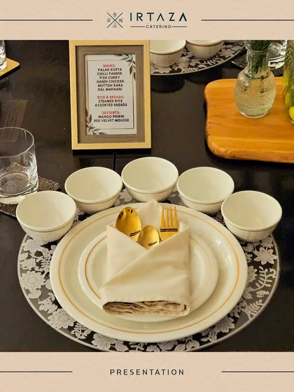 An elegant place setting for a sit-down dinner. It features a framed menu, gold-rimmed plates, and folded napkins with golden cutlery, showcasing my attention to detail for formal dining experiences.
