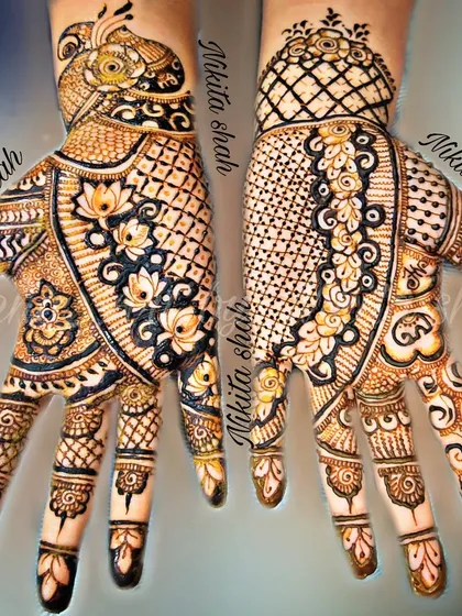 An intricate Indo-Western design that combines the best of both worlds. You have the bold peacock and floral elements paired with delicate, modern patterns.