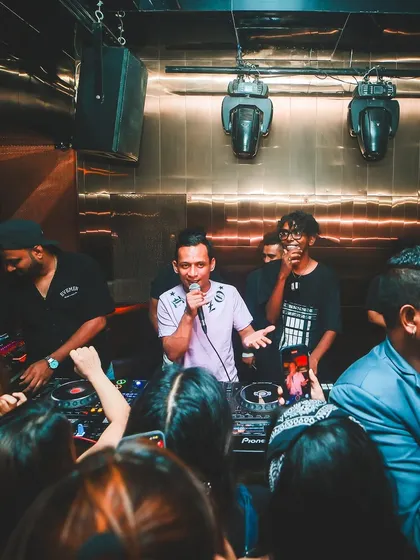The DJ booth is the command center. Here I am with the crew, hyping up the crowd and making sure the vibe is just right for a memorable night.