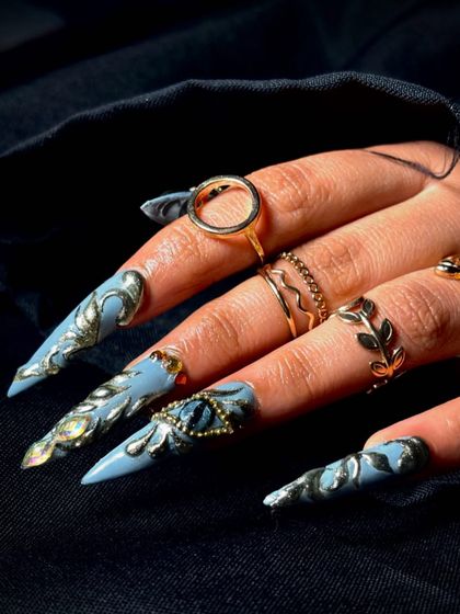 A full view of the unique and artistic "evil eye" nail set, perfect for a fantasy portfolio.