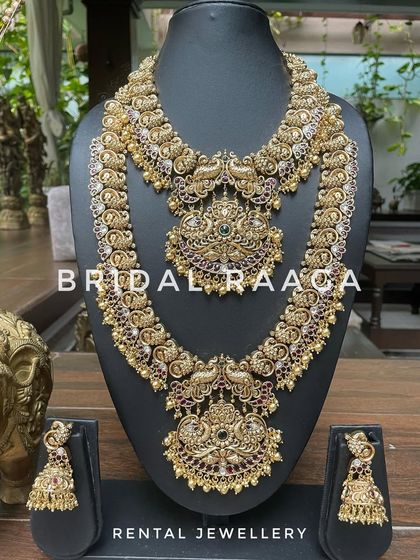 A majestic peacock-themed bridal set in a dark antique finish. The detailed craftsmanship and Kemp stone work make this a truly unique piece.