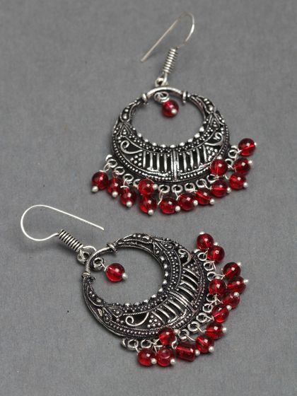 These oxidized silver chandbalis with red beads are part of our affordable daily wear collection. They are stylish, lightweight, and perfect for any occasion.