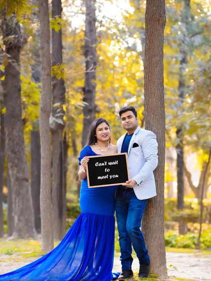 Let's have some fun with props! A simple chalkboard with a sweet message adds a personal and playful touch to your couple portraits, telling the story of your excitement.