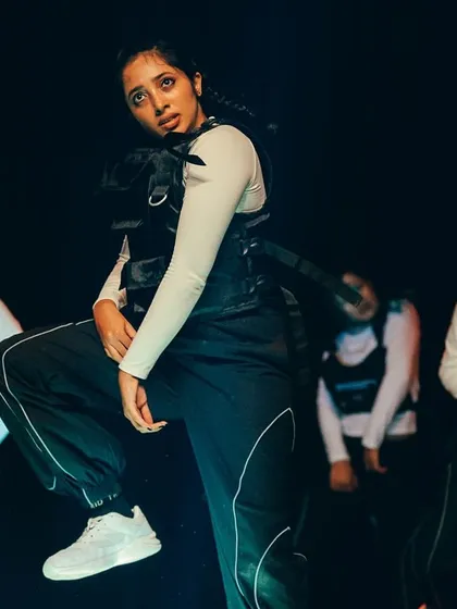 A close-up of a dancer fully in her element during the hip-hop history performance.
