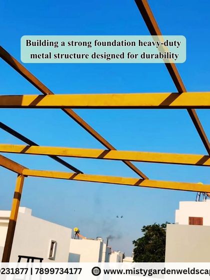 Building a strong foundation with a heavy-duty metal structure designed for durability. This yellow-coated frame is the backbone of what will be a stylish and long-lasting pergola.