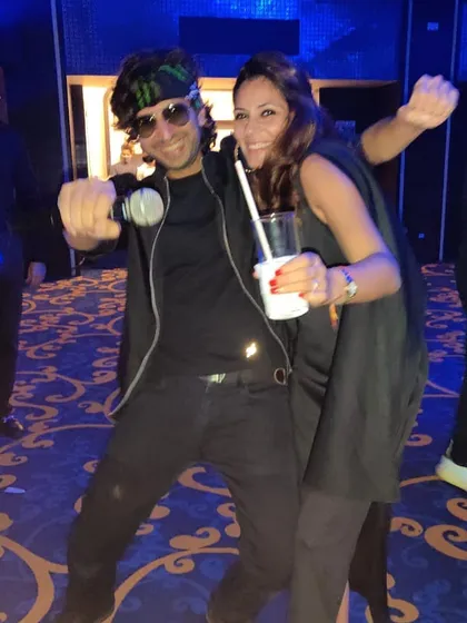 Capturing a fun moment with a guest on the dance floor. My goal is to be more than just the DJ; I'm part of your celebration, creating personal connections and great memories.