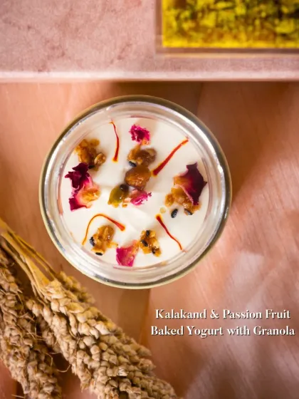 Kalakand & Passion Fruit Baked Yogurt with Granola. A creamy, tangy, and crunchy dessert served in a jar, combining the richness of kalakand with the tropical flavor of passion fruit.