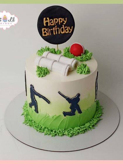 A cricket lover's dream cake, featuring wickets, a ball, and player silhouettes on a grassy field.