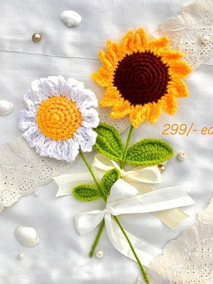 A cheerful pair of our best-selling single stems: a crochet daisy and a sunflower, both priced at ₹299 each.