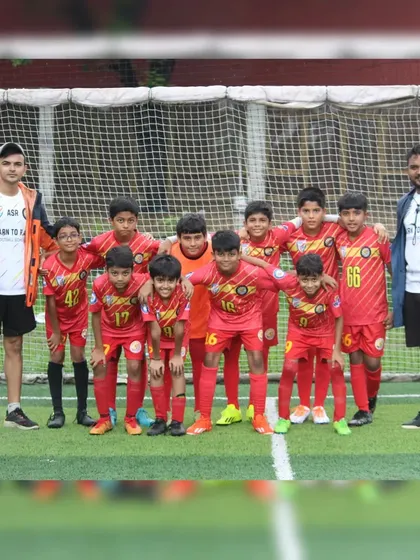 The U11 Avengers team with their coaches at the Grassroots Football Fiesta.
