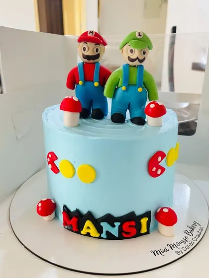 Okey-Dokey, it's a Mario cake. This cake brings the classic video game to life with handcrafted fondant figures of Mario and Luigi, complete with mushrooms and other game elements.