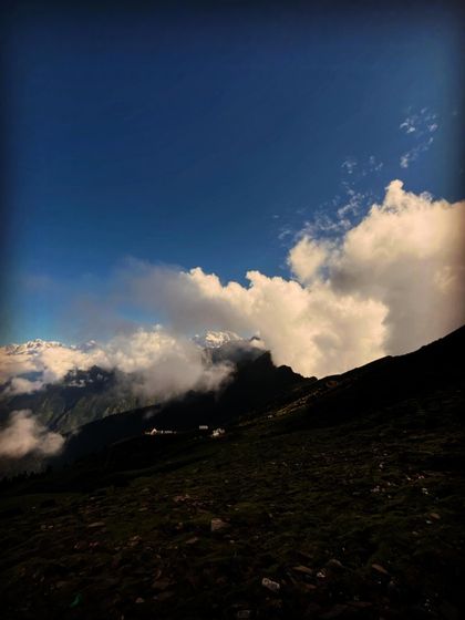 A stunning view of the clouds rolling over the Himalayan peaks.