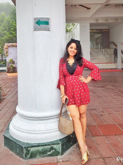 A red printed romper is a fun and flirty choice for a day out.