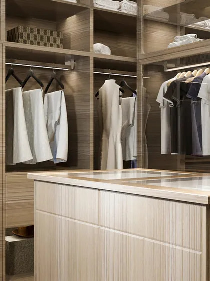 A spacious walk-in closet with a wood veneer finish and a central island. We combine open-hanging sections with closed storage to suit different needs.