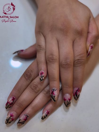 Our artists can create custom floral designs to match your style, like this beautiful pink and black branch pattern.