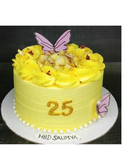 An urgent order for a beautiful rasmalai cake. This cake is decorated in a cheerful yellow with delicate butterflies and edible pearls.