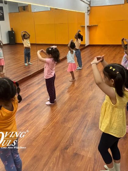 Kids practicing their moves in front of the mirror. This helps them with coordination and body awareness.