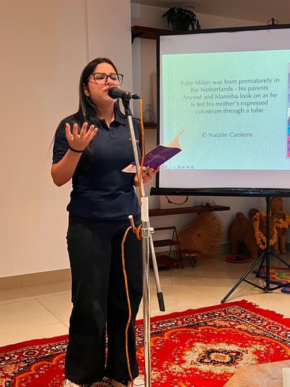 A participant sharing her thoughts during the discussion on breastfeeding. We aim to create interactive events where the audience can actively engage with the topic.