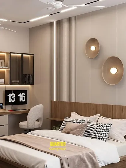 This modern teenager's bedroom is designed to be a stylish retreat. The design includes a large two-person workstation with overhead storage, perfect for homework and hobbies. The back wall features a mix of wood paneling and neutral tones.