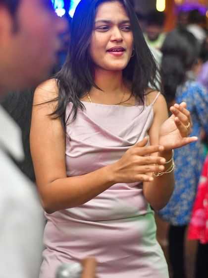 Friends chatting and enjoying the music during a packed midweek party.