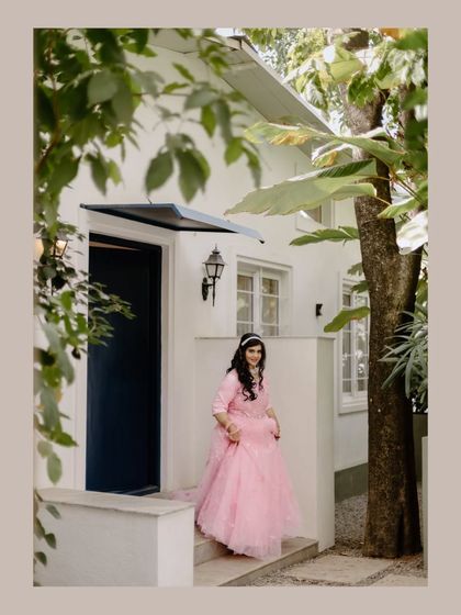 A bride poses on the steps of one of our cottages. The natural light and surrounding trees create a soft and beautiful setting for a portrait.
