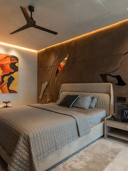 Another angle of the Lodha Worldview bedroom, highlighting the interplay of light and texture. The opulent marble finish of the wall, with its organic veining, lends an effortless, timeless sophistication that melds into the space.