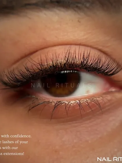 This is the goal: flawless, fluttery lashes that look and feel like your own, but better. This close-up shows the detail and artistry in a classic eyelash extension set, designed to enhance your natural eye shape.