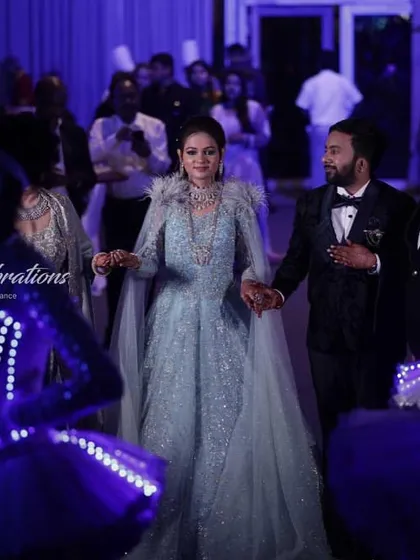 The couple is all smiles as they are welcomed by dancers in glowing costumes. I focus on creating an experience that is not only visually spectacular but also incredibly fun for the couple.