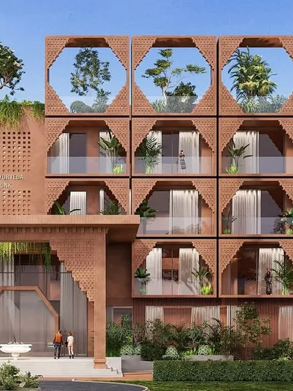 A frontal view of the Tirupati retreat, showcasing the rhythmic pattern of the arches and balconies. The design is rooted in Vastu and nurtured by Ayurveda, offering a sense of calm and purity.