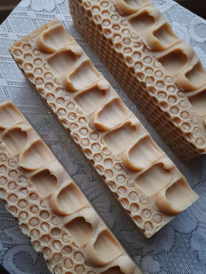 Several loaves of my Goatmilk, Oats, and Honey soap, showing off their beautiful, textured tops. This is one of my most popular bars for sensitive and dry skin.