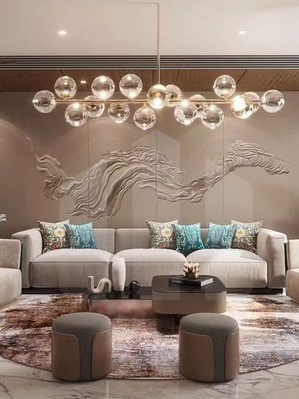 This living space is designed for luxurious comfort and sophisticated relaxation. We combined a neutral color palette with pops of teal, a stunning 3D wall sculpture, and a modern bubble chandelier to create a formal living room that is both classy and inviting.