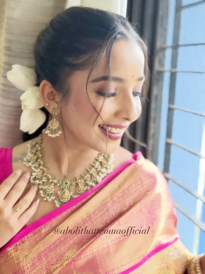 A soft glam makeup look created for the Zee Marathi Awards. This candid, smiling shot shows how the makeup looks natural and joyful.