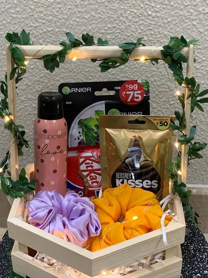 My rustic hexagon basket is a popular choice for a fun and thoughtful gift. This one is filled with self-care goodies like a Garnier face mask, a 'love' deodorant, colorful scrunchies, and of course, some delicious Hershey's Kisses and KitKat.