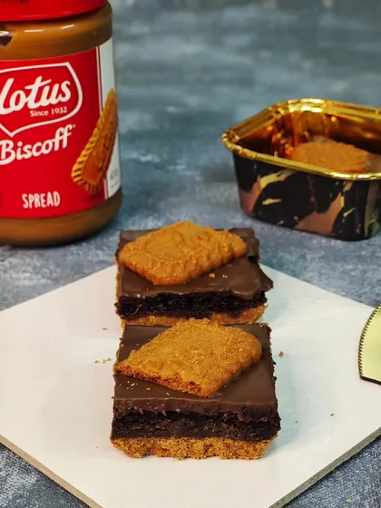A close look at my popular Crusty Biscoff Brownie. This decadent treat features a fudgy brownie base layered with rich Biscoff spread and topped with a signature Lotus biscuit, making it a favorite for gift boxes.