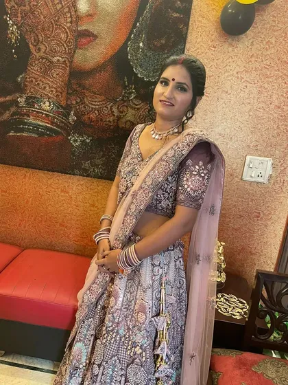 The same lavender lehenga, showing the complete look with a sheer dupatta and matching jewellery.