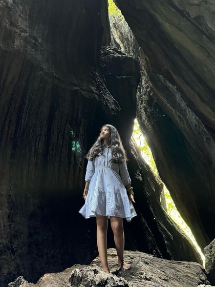 A trekker inside the stunning Yaana caves.