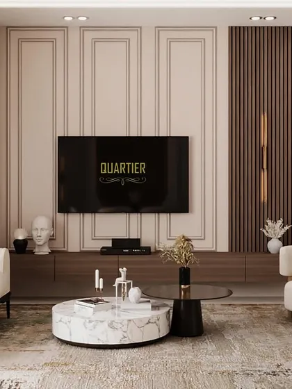 A 3D visualization of the living area at ATS Rhapsody, featuring a full-height TV unit with integrated glass storage for artifacts. The design uses a combination of wood tones and classic paneling for a refined look.