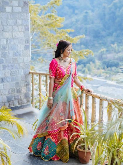 A beautiful portrait of the bride against the scenic, hilly backdrop of her Jim Corbett venue.
