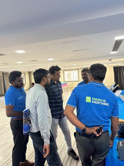 My team, wearing our "Energy is Everything" shirts, in discussion with partners at the Chennai Retailer Meet.