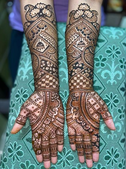 An elegant design featuring hanging temple bells (jhumkas) and a mix of floral and geometric patterns.