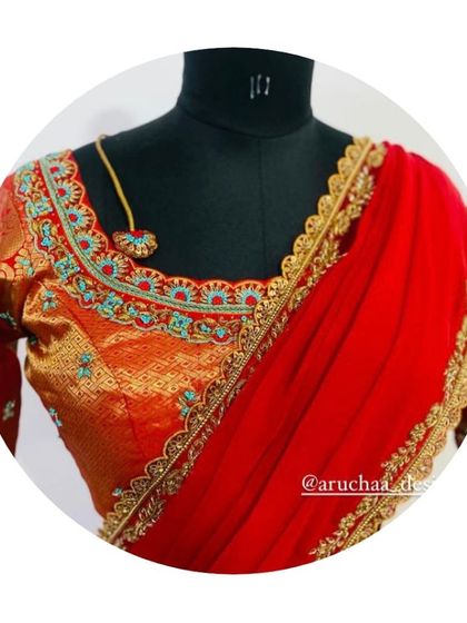 The front view of the half saree blouse, showing the detailed neckline embroidery and the elegant cut. The matching red dupatta with a golden border completes the ensemble.