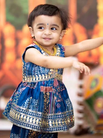 Another shot of this little cutie showing off her Garba moves. I make sure to capture a variety of poses and expressions during these energetic festive baby photoshoots.
