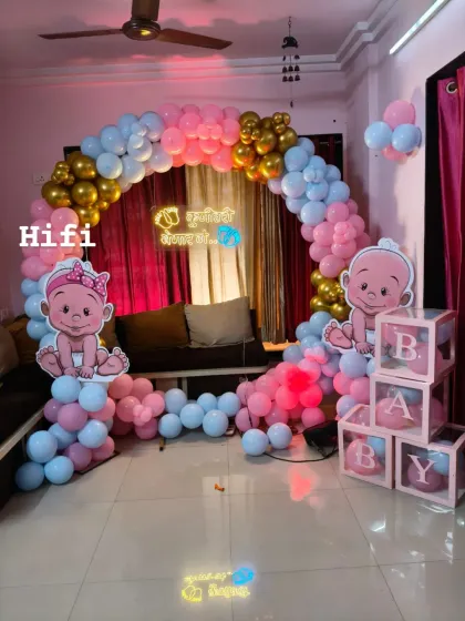 Welcoming a new baby is a precious moment. We designed this charming and modern baby shower decor for an at-home celebration, featuring a pink and blue balloon arch, cute baby cutouts, and custom neon signage for that perfect photo backdrop.