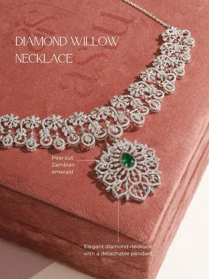 This is the Diamond Willow necklace, featuring an elegant diamond collar and a stunning detachable pendant centered with a pear-cut Zambian emerald. One piece offers two distinct expressions.