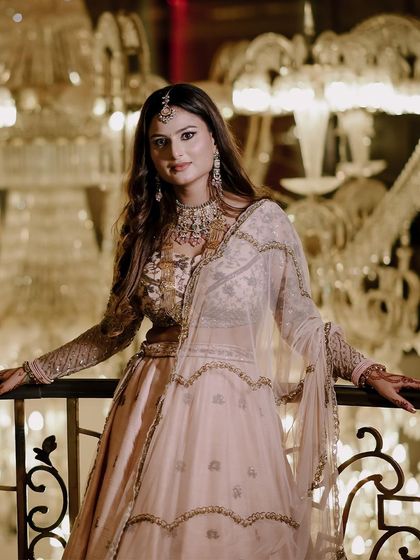 A closer portrait of the bride, Ashi, showcasing her beautiful makeup and serene expression.