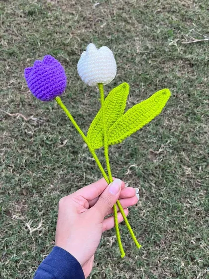 Two simple and elegant crochet tulips, one purple and one white. These single stems are perfect for a minimalist display.