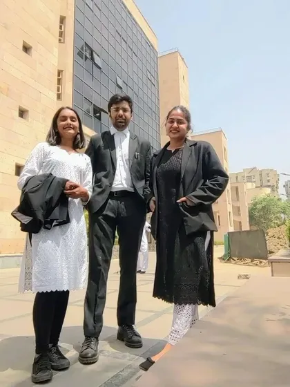 A sunny day outside the court with my colleagues. Teamwork is essential in the legal field, and I'm proud of the people I work with.